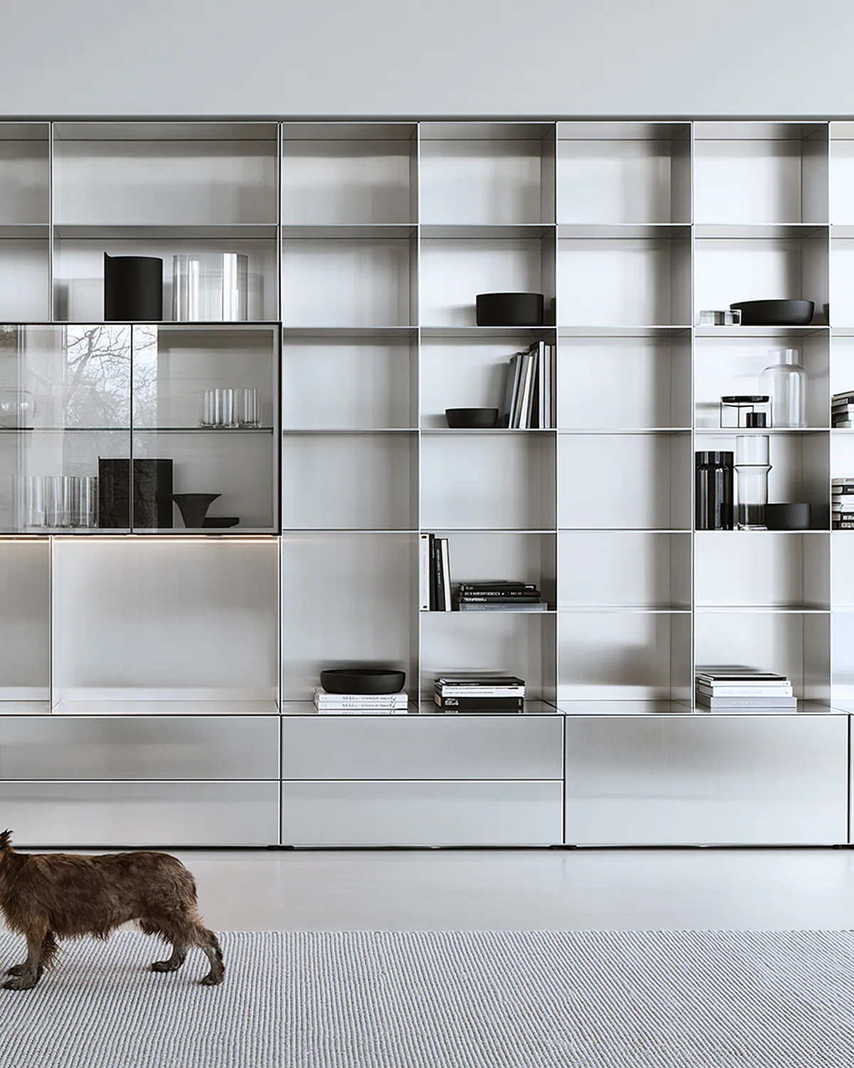 A silver modular aluminum display wall, shown as an associated cabinet detail