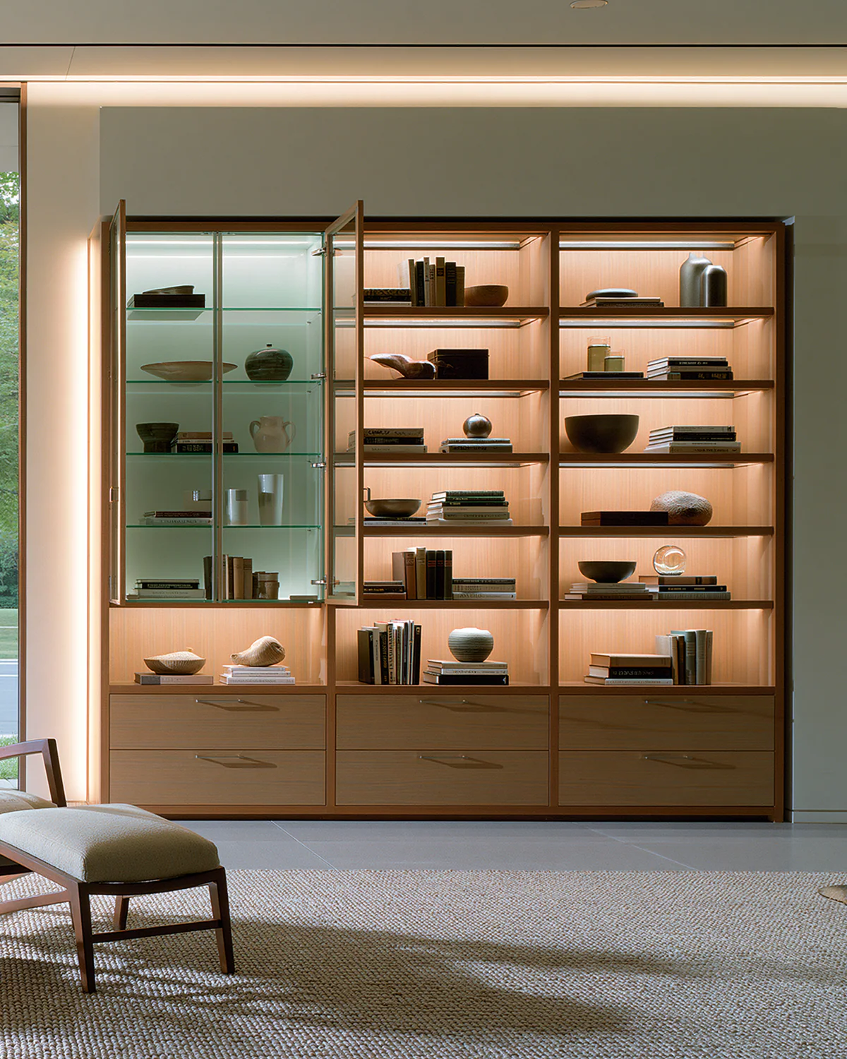 A wood and glass living room library wall, shown as an associated cabinet detail