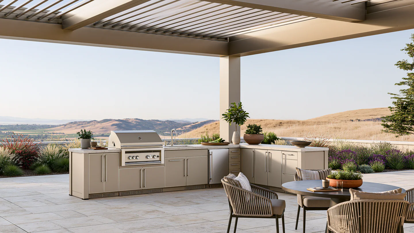 A sand beige modular aluminum outdoor kitchen, shown as a wide room view