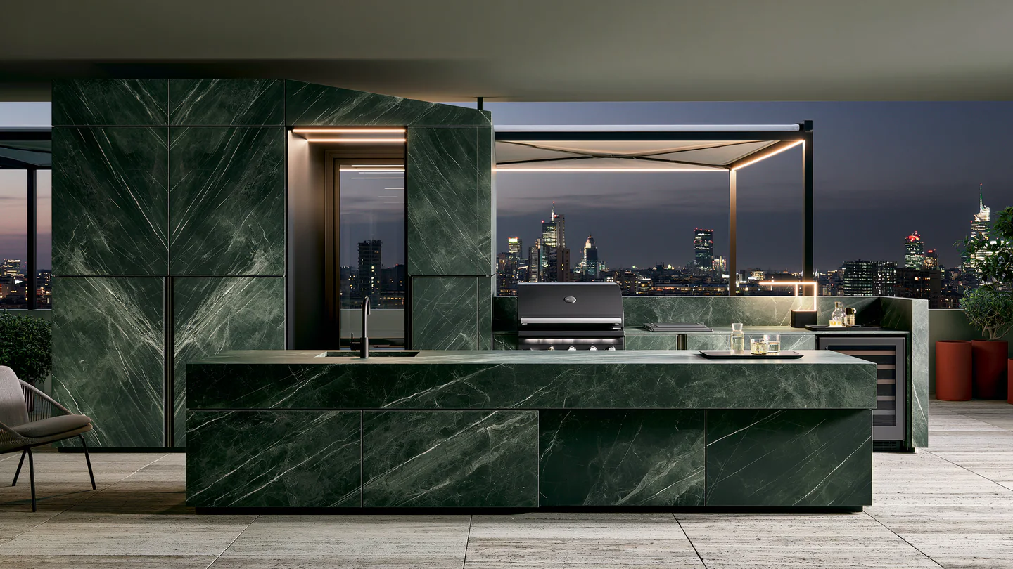 A dark veined sintered stone rooftop kitchen, shown as a wide room view