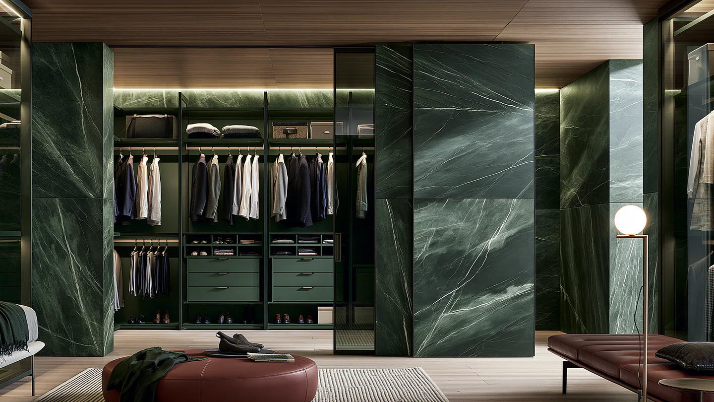 Dark sintered stone wardrobe doors, shown as a wide room view