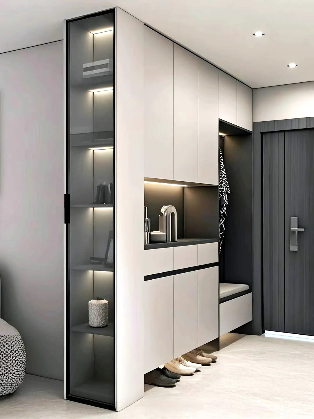Two-tone entry cabinets with glass display storage, concealed drawers and a recessed niche