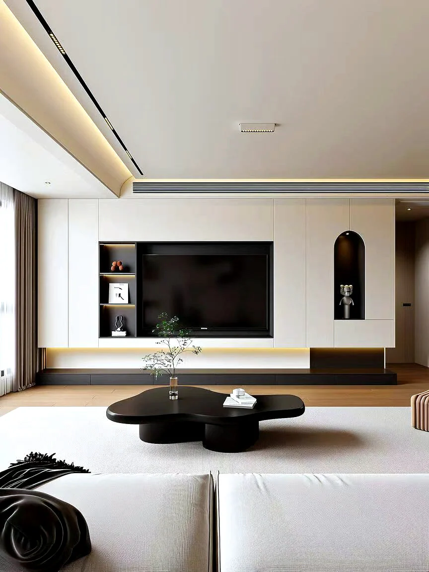Pale full-wall media cabinet with a dark television recess and low floating storage